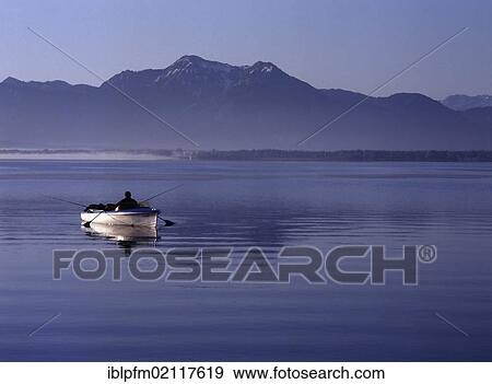 Early morning fishing on lake Chiemsee, Chiemgau, Upper Bavaria, Germany, Europe View Large Photo Image Stock Photo - Early morning fishing on lake Chiemsee, Chiemgau, Upper Bavaria, Germany, Europe. Fotosearch