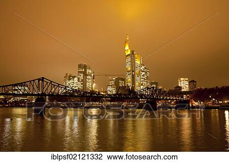 Eiserner Steg Bruecke, bridge over the Main river with the illuminated skyline of Frankfurt at dusk, Frankfurt am Main, Hesse, Germany, Europe View Large Photo Image Stock Image - Eiserner Steg Bruecke, bridge over the Main river with the illuminated skyline of Frankfurt at dusk, Frankfurt am Main, Hesse, Germany, Europe. Fotosearch