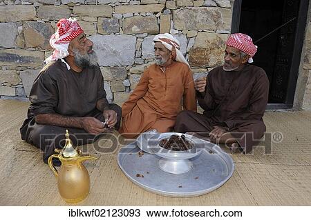 Elderly Arab men wearing traditional dress, dishdasha or kandora, eating dates, Schindagha, Dubai, United Arab Emirates, Arabia, Arabian Peninsula, Asia View Large Photo Image Stock Image - Elderly Arab men wearing traditional dress, dishdasha or kandora, eating dates, Schindagha, Dubai, United Arab Emirates, Arabia, Arabian Peninsula, Asia. Fotosearch