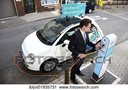 Electric car of the Emscher Lippe Energie GmbH, ELE, type Fiat 500, at a charging station, Gelsenkirchen, North Rhine-Westphalia, Germany, Europe View Large Photo Image Stock Image - Electric car of the Emscher Lippe Energie GmbH, ELE, type Fiat 500, at a charging station, Gelsenkirchen, North Rhine-Westphalia, Germany, Europe. Fotosearch