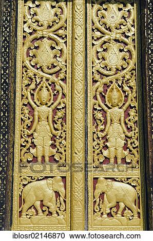 Entrance door ornamented with gold reliefs, Wat Xieng Thong temple, Luang Prabang, Laos, Indochina, Asia View Large Photo Image Stock Image - Entrance door ornamented with gold reliefs, Wat Xieng Thong temple, Luang Prabang, Laos, Indochina, Asia. Fotosearch