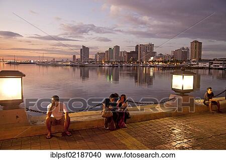 Evening in Harbour Square in front of the skyline along Manila Bay, Manila, Philippines, Asia View Large Photo Image Stock Image - Evening in Harbour Square in front of the skyline along Manila Bay, Manila, Philippines, Asia. Fotosearch