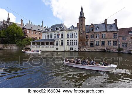 Excursion boat with tourists at the Historical Centre with guild houses on Rozenhoedkaai, Quay of the Rosary, historic city centre of Bruges, UNESCO World Heritage Site, West Flanders, Flemish Region, Belgium, Europe View Large Photo Image Picture - Excursion boat with tourists at the Historical Centre with guild houses on Rozenhoedkaai, Quay of the Rosary, historic city centre of Bruges, UNESCO World Heritage Site, West Flanders, Flemish Region, Belgium, Europe. Fotosearch