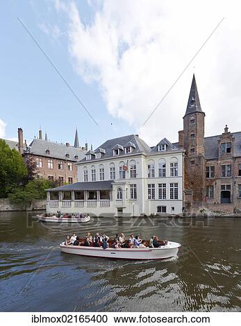 Excursion boat with tourists at the Historical Centre with guild houses on Rozenhoedkaai, Quay of the Rosary, historic city centre of Bruges, UNESCO World Heritage Site, West Flanders, Flemish Region, Belgium, Europe View Large Photo Image Stock Image - Excursion boat with tourists at the Historical Centre with guild houses on Rozenhoedkaai, Quay of the Rosary, historic city centre of Bruges, UNESCO World Heritage Site, West Flanders, Flemish Region, Belgium, Europe. Fotosearch