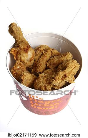 Stock Photo - Fast food, crumbed and fried chicken pieces in a paper bucket from Kentucky Fried Chicken. Fotosearch