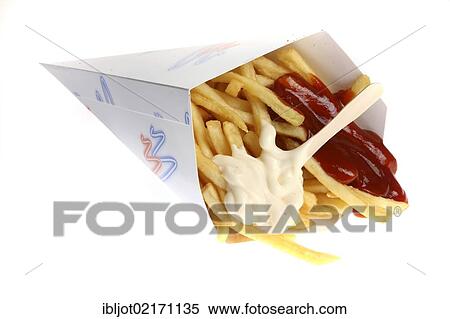 Stock Photography - Fast food, French fries in a bag with ketchup and mayonnaise. Fotosearch