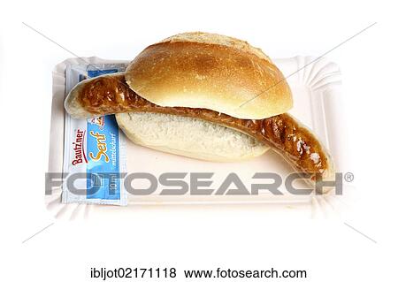 Fast food, grilled sausage in a bun with mustard View Large Photo Image Stock Photo - Fast food, grilled sausage in a bun with mustard. Fotosearch
