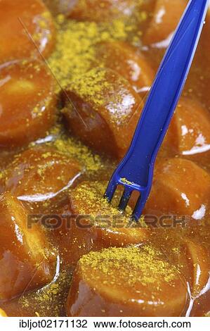 Fast food, sliced sausage with curry powder View Large Photo Image Stock Image - Fast food, sliced sausage with curry powder. Fotosearch