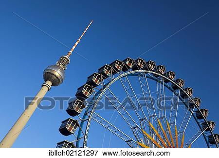 Stock Photo - Fernsehturm television tower and Ferris wheel against a blue sky, Berlin, Germany, Europe, PublicGround, Europe. Fotosearch
