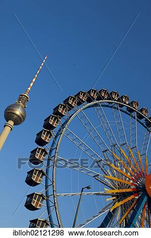 Fernsehturm television tower and Ferris wheel against a blue sky, Berlin, Germany, Europe, PublicGround, Europe View Large Photo Image Stock Photo - Fernsehturm television tower and Ferris wheel against a blue sky, Berlin, Germany, Europe, PublicGround, Europe. Fotosearch