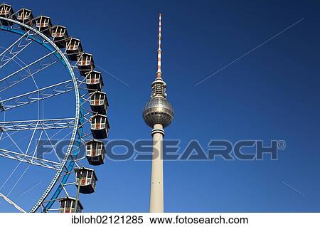 Fernsehturm television tower and Ferris wheel against a blue sky, Berlin, Germany, Europe, PublicGround, Europe View Large Photo Image Stock Photography - Fernsehturm television tower and Ferris wheel against a blue sky, Berlin, Germany, Europe, PublicGround, Europe. Fotosearch