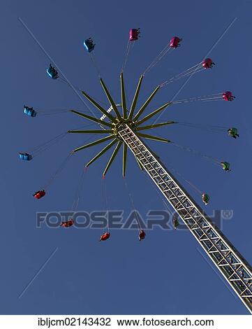 Ferris wheel spider against a blue sky View Large Photo Image Stock Image - Ferris wheel spider against a blue sky. Fotosearch