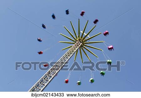 Ferris wheel spider against a blue sky View Large Photo Image Stock Image - Ferris wheel spider against a blue sky. Fotosearch