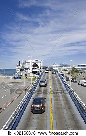 Stock Photo - Ferry terminal with linkspan, vehicle loading road, Puttgarden, Fehmarn Island, Baltic Sea, Schleswig-Holstein, Germany, Europe. Fotosearch