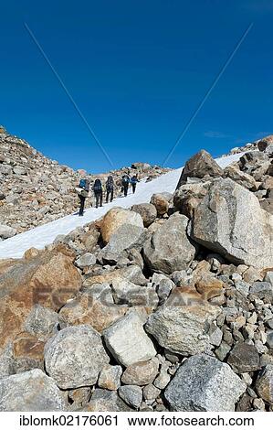 Field of snow and boulders, hikers at Mittivakkat Glacier, Ammassalik Peninsula, East Greenland, Greenland, North America View Large Photo Image Stock Image - Field of snow and boulders, hikers at Mittivakkat Glacier, Ammassalik Peninsula, East Greenland, Greenland, North America. Fotosearch