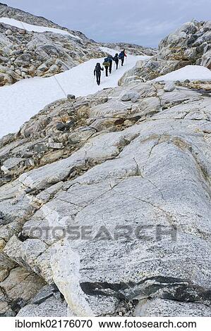 Field of snow and rock structures, hikers at Mittivakkat Glacier, Ammassalik Peninsula, East Greenland, Greenland, North America View Large Photo Image Stock Image - Field of snow and rock structures, hikers at Mittivakkat Glacier, Ammassalik Peninsula, East Greenland, Greenland, North America. Fotosearch