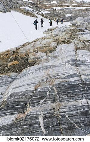 Field of snow and rock structures, hikers at Mittivakkat Glacier, Ammassalik Peninsula, East Greenland, Greenland, North America View Large Photo Image Stock Image - Field of snow and rock structures, hikers at Mittivakkat Glacier, Ammassalik Peninsula, East Greenland, Greenland, North America. Fotosearch