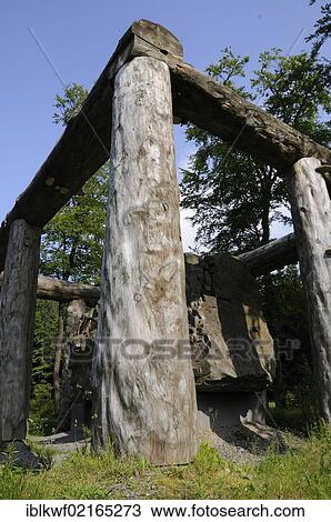 Fir logs from the Vosges and a monolithic stone for the sculpture Stein-Zeit-Mensch, stone-age-man, by Nils-Udo, sculpture experience forest path, Rothaarsteig hiking trail, North Rhine-Westphalia, Germany, Europe View Large Photo Image Stock Image - Fir logs from the Vosges and a monolithic stone for the sculpture Stein-Zeit-Mensch, stone-age-man, by Nils-Udo, sculpture experience forest path, Rothaarsteig hiking trail, North Rhine-Westphalia, Germany, Europe. Fotosearch