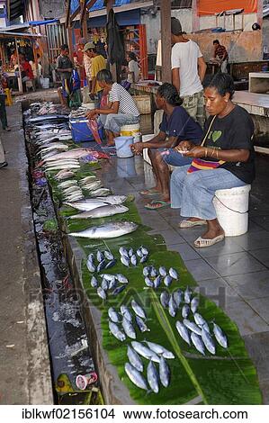 Picture - Fish sales at the fish market, fish are presented on banana leaves, Kota Biak, Biak Island, Irian Jaya, Indonesia, Southeast Asia, Asia. Fotosearch