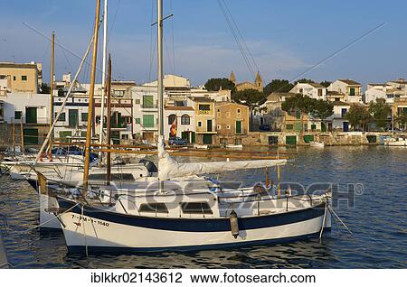 Fishing boats in Porto Colom, Majorca, Balearic Islands, Spain, Europe View Large Photo Image Stock Image - Fishing boats in Porto Colom, Majorca, Balearic Islands, Spain, Europe. Fotosearch