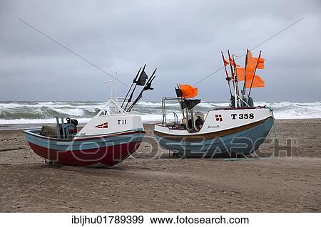 Fishing boats on the beach of Stenbjerg Landingsplads during a storm, North Sea, Thy district, northern Jutland, Jutland peninsula, Denmark, Europe View Large Photo Image Stock Photo - Fishing boats on the beach of Stenbjerg Landingsplads during a storm, North Sea, Thy district, northern Jutland, Jutland peninsula, Denmark, Europe. Fotosearch