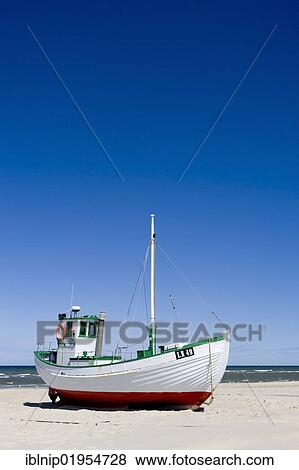 Fishing cutter on the beach in Loekken or Lokken, Northern Jutland, Denmark, Europe View Large Photo Image Stock Photo - Fishing cutter on the beach in Loekken or Lokken, Northern Jutland, Denmark, Europe. Fotosearch