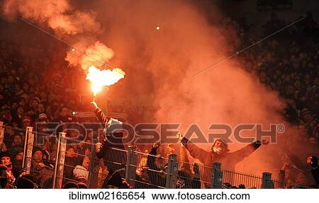 Picture - Flares, fire, fireworks, Bavaria fan block, Mercedes-Benz Arena, Stuttgart, Baden-Wuerttemberg, Germany, Europe. Fotosearch
