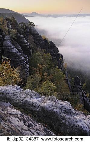 Fog above the river Elbe in the Elbe Sandstone Mountains, Saxon Switzerland, Saxony, Germany, Europe View Large Photo Image Stock Photo - Fog above the river Elbe in the Elbe Sandstone Mountains, Saxon Switzerland, Saxony, Germany, Europe. Fotosearch