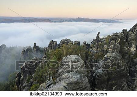 Stock Photo - Fog in the Elbe Sandstone Mountains, Saxon Switzerland, Saxony, Germany, Europe. Fotosearch