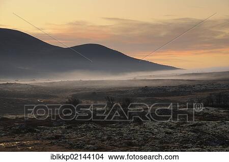 Fog over a fjell landscape in Dovrefjell Sunndalsfjella National Park, Norway, Europe View Large Photo Image Picture - Fog over a fjell landscape in Dovrefjell Sunndalsfjella National Park, Norway, Europe. Fotosearch