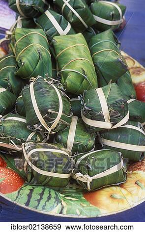 Food wrapped in banana leaves, Talat Tha Heua Market, Luang Prabang, Laos, Indochina, Asia View Large Photo Image Stock Photo - Food wrapped in banana leaves, Talat Tha Heua Market, Luang Prabang, Laos, Indochina, Asia. Fotosearch