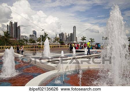 Fountains on the refurbished seafront promenade of Cinta Costera and the skyline of Panama City, Panama, Central America, North America View Large Photo Image Stock Photograph - Fountains on the refurbished seafront promenade of Cinta Costera and the skyline of Panama City, Panama, Central America, North America. Fotosearch
