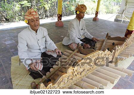 Stock Image - Gamelan players at a Hindu temple ceremony, Nusa Dua, Bali, Indonesia, Southeast Asia, Asia. Fotosearch
