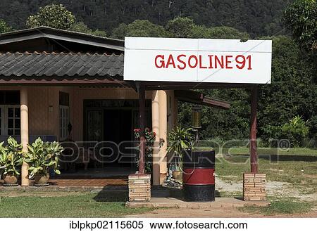 Stock Photography - Gasoline station in front of a house, Koh Lanta, Thailand, Asia. Fotosearch