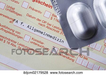Stock Photo - German medical referral slip with tablets. Fotosearch