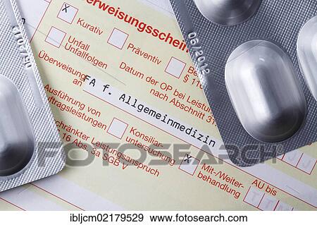 Stock Photo - German medical referral slip with tablets. Fotosearch