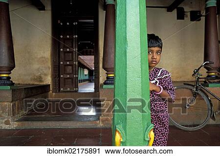 Girl hiding behind green a pillar, old mansion, Chettinad, Tamil Nadu, South India, India, Asia View Large Photo Image Stock Image - Girl hiding behind green a pillar, old mansion, Chettinad, Tamil Nadu, South India, India, Asia. Fotosearch