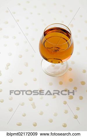 Glass of Cognac and droplets View Large Photo Image Stock Photo - Glass of Cognac and droplets. Fotosearch