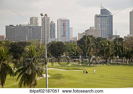 Golf course in the town centre with the skyline of Manila, Philippines, Asia View Large Photo Image Stock Image - Golf course in the town centre with the skyline of Manila, Philippines, Asia. Fotosearch