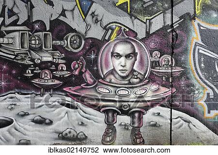 Graffiti, man in a flying saucer with a glass dome on the moon, Bruckhausen quarter, Duisburg, North Rhine-Westphalia, Germany, Europe View Large Photo Image Stock Image - Graffiti, man in a flying saucer with a glass dome on the moon, Bruckhausen quarter, Duisburg, North Rhine-Westphalia, Germany, Europe. Fotosearch