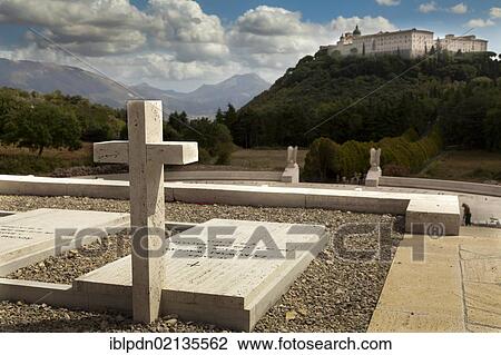 Stock Image - Gravestones in the Polish Cemetery towards Monte Cassino Abbey, Lazio, Italy, Europe. Fotosearch