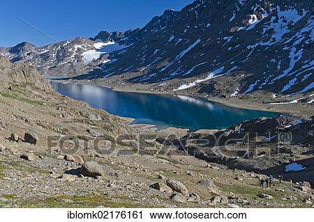 Group of hikers at a lake near Tasiilaq or Ammassalik, East Greenland, Greenland, North America View Large Photo Image Stock Image - Group of hikers at a lake near Tasiilaq or Ammassalik, East Greenland, Greenland, North America. Fotosearch