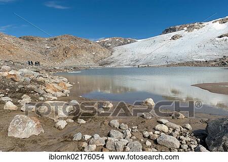 Group of hikers at Mittivakkat Glacier, Peninsula Ammassalik, East Greenland, Greenland, North America View Large Photo Image Picture - Group of hikers at Mittivakkat Glacier, Peninsula Ammassalik, East Greenland, Greenland, North America. Fotosearch