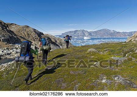 Group of hikers at Sermelik Fjord, Ammassalik Peninsula, East Greenland, Greenland, North America View Large Photo Image Stock Photograph - Group of hikers at Sermelik Fjord, Ammassalik Peninsula, East Greenland, Greenland, North America. Fotosearch