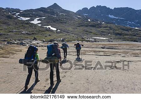 Stock Photo - Group of hikers near Tasiilaq or Ammassalik, East Greenland, Greenland, North America. Fotosearch