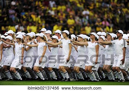 Group of white-clad youths doing a gymnastics display before a football game in the Signal Iduna Arena, Dortmund, North Rhine-Westphalia, Germany, Europe View Large Photo Image Stock Photograph - Group of white-clad youths doing a gymnastics display before a football game in the Signal Iduna Arena, Dortmund, North Rhine-Westphalia, Germany, Europe. Fotosearch