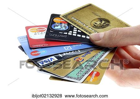Hand holding a fan of of credit cards, bank cards View Large Photo Image Stock Photo - Hand holding a fan of of credit cards, bank cards. Fotosearch