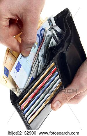 Stock Image - Hands holding wallet with various credit cards, bank cards, euro notes. Fotosearch