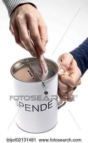Hands with a donation box labeled Spende, German for donation, with slots for coins and bills, with a security seal to protect against unlawful opening View Large Photo Image Stock Image - Hands with a donation box labeled Spende, German for donation, with slots for coins and bills, with a security seal to protect against unlawful opening. Fotosearch