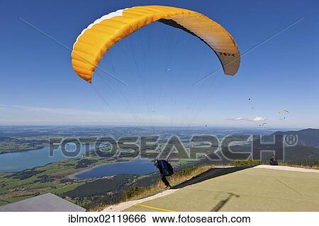 Hang glider taking off, Mt Tegelberg, Froggensee Lake at back, Upper Bavaria, Bavaria, Germany, Europe, PublicGround, Europe View Large Photo Image Stock Photograph - Hang glider taking off, Mt Tegelberg, Froggensee Lake at back, Upper Bavaria, Bavaria, Germany, Europe, PublicGround, Europe. Fotosearch